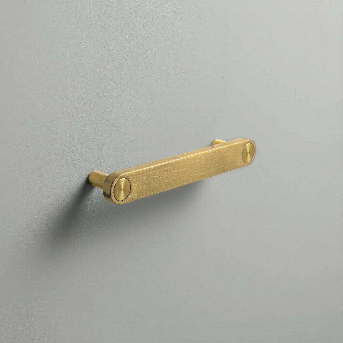 Brass Ensemble Handle in 128mm (5″) Centres size with Brass button detail by Sloan Roberts.