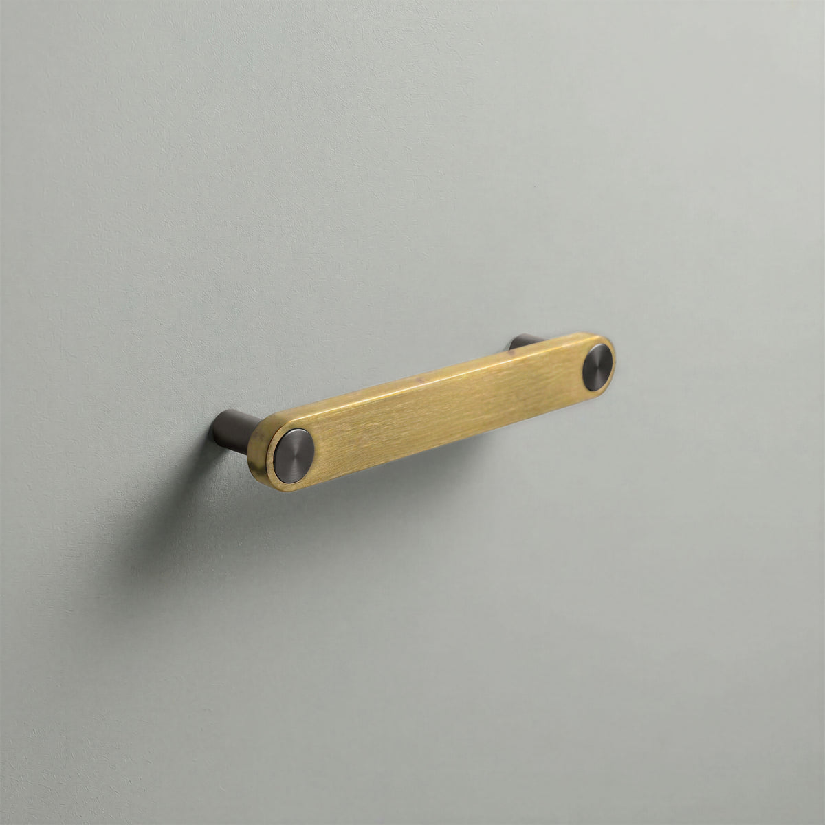 Brass Ensemble Handle in 128mm (5″) Centres size with Gunmetal button detail by Sloan Roberts.