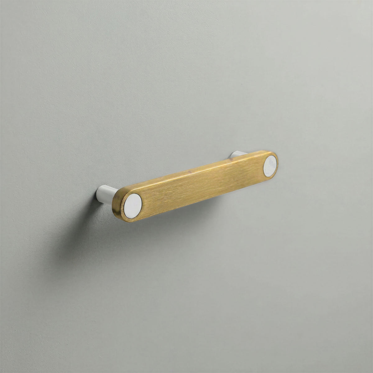 Brass Ensemble Handle in 128mm (5″) Centres size with Matte White button detail by Sloan Roberts.