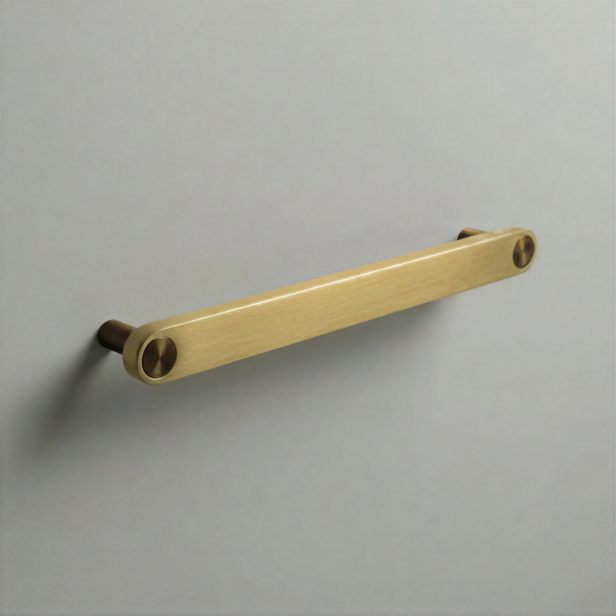 Brass Ensemble Handle in 192mm (7½″) Centres size with Aged Bronze button detail by Sloan Roberts.