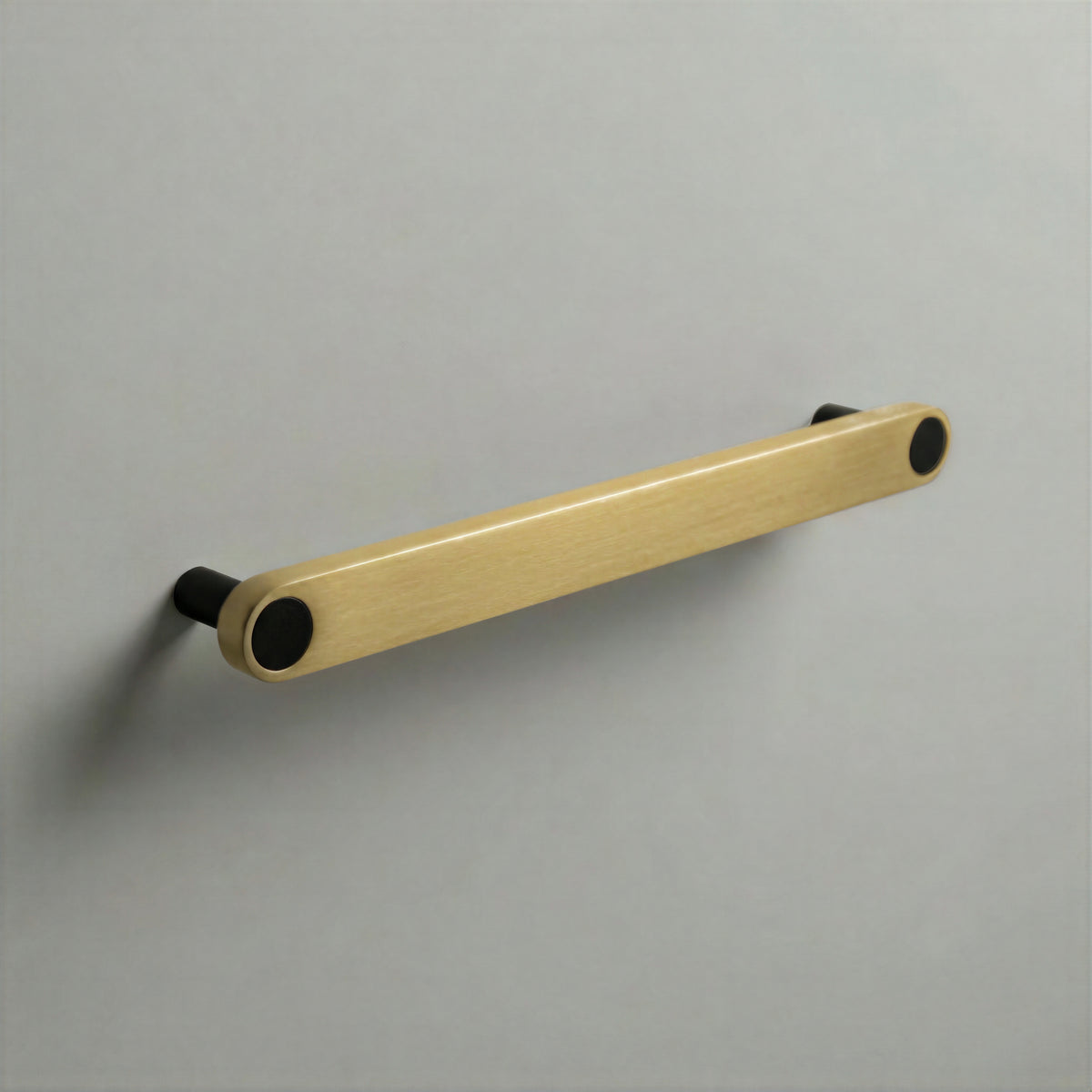 Brass Ensemble Handle in 192mm (7½″) Centres size with Matte Black button detail by Sloan Roberts.
