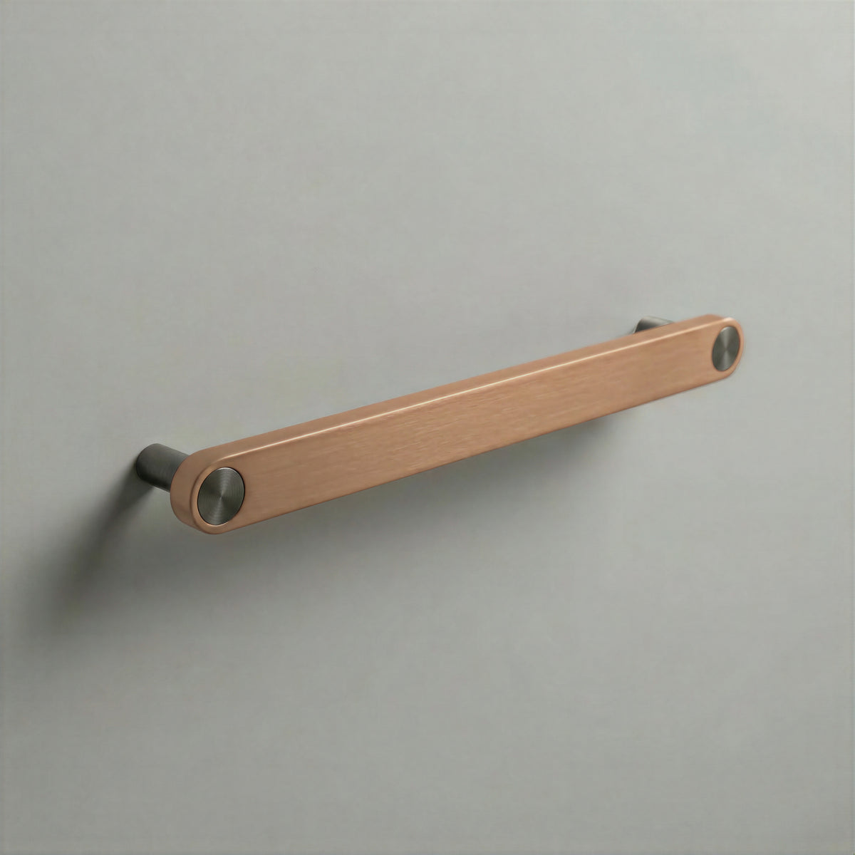 Brushed Copper Ensemble Handle in 192mm (7½″) Centres size with Gunmetal button detail by Sloan Roberts.