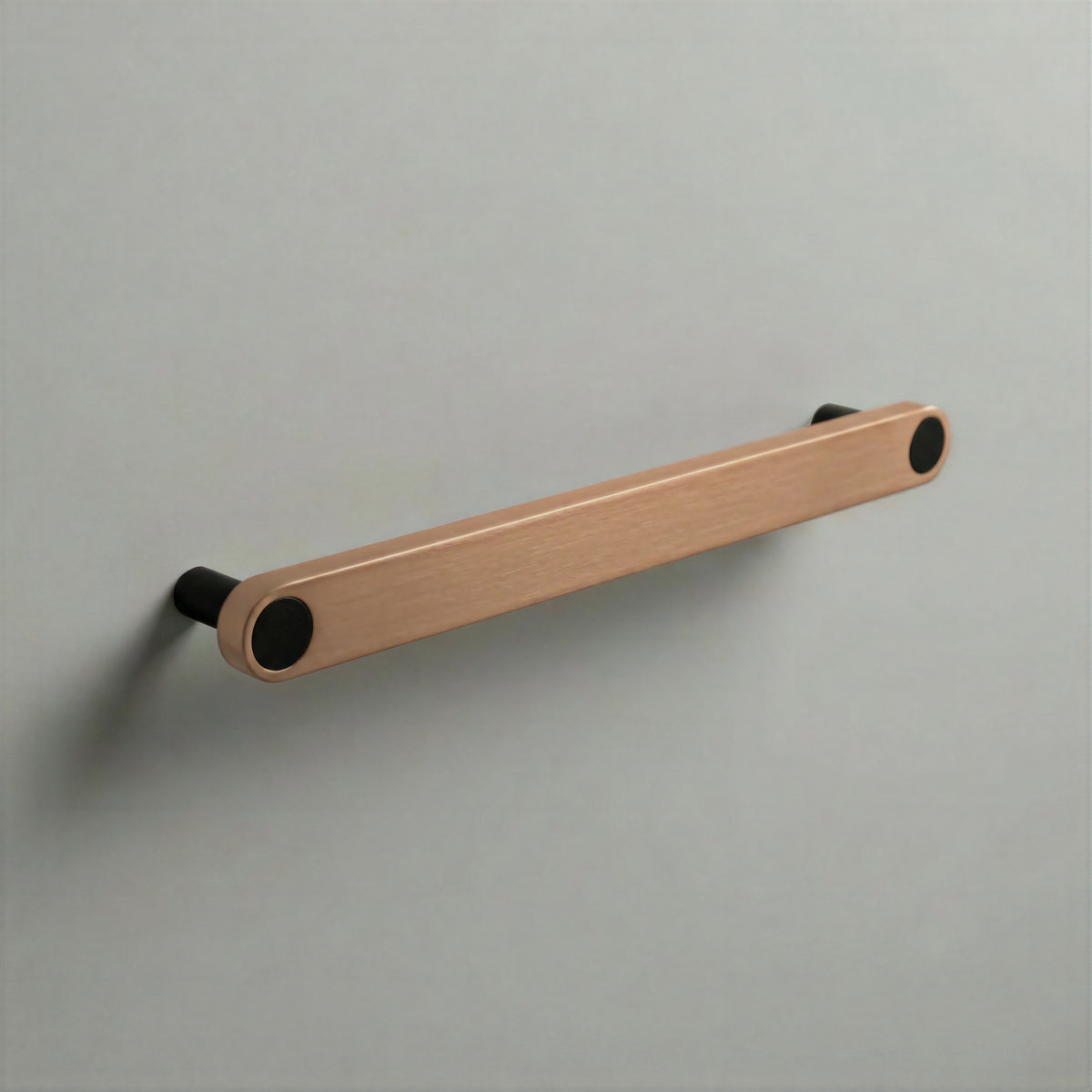 Brushed Copper Ensemble Handle in 192mm (7½″) Centres size with Matte Black button detail by Sloan Roberts.