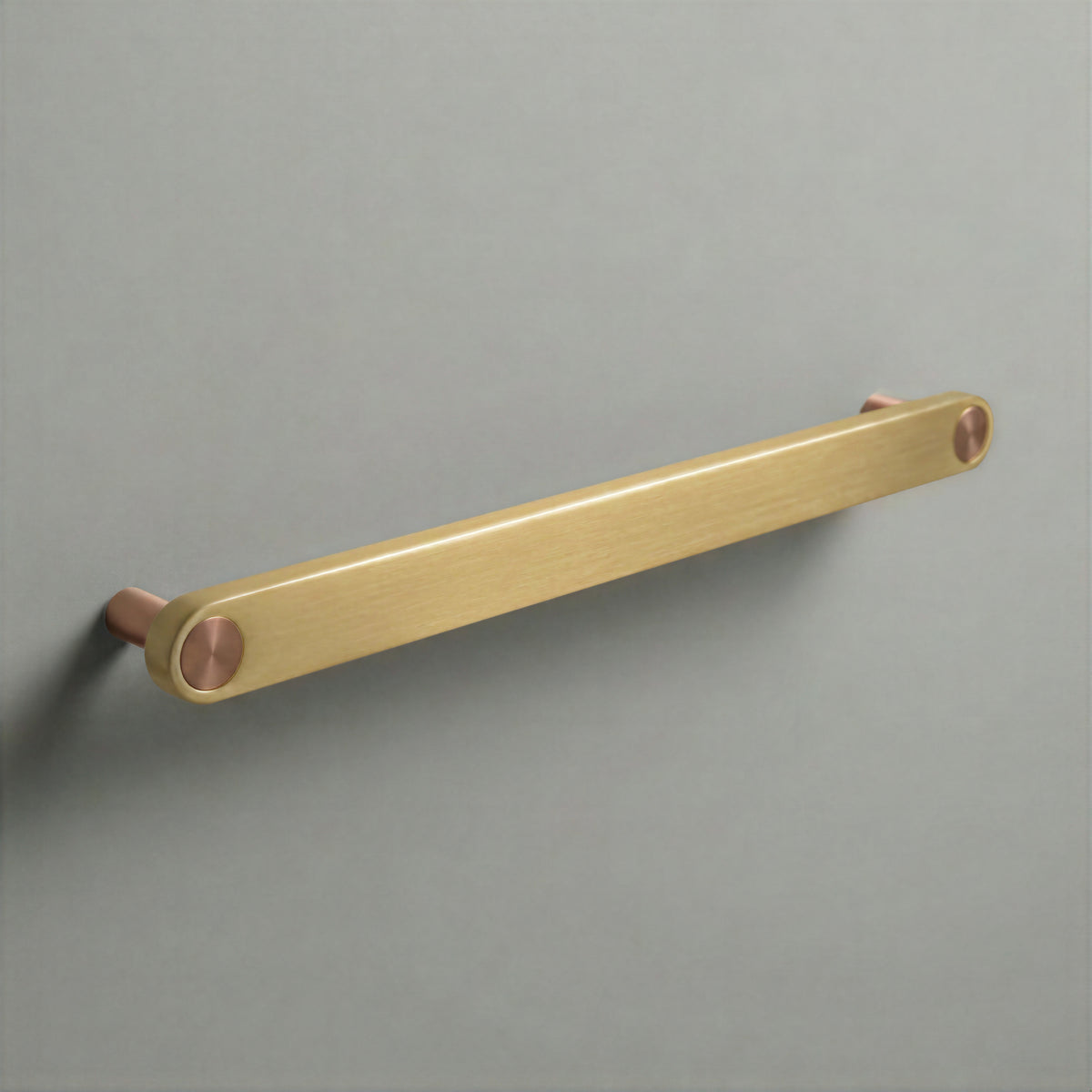 Brass Ensemble Handle in 224mm (8⅞″) Centres size with Brushed Copper button detail by Sloan Roberts.