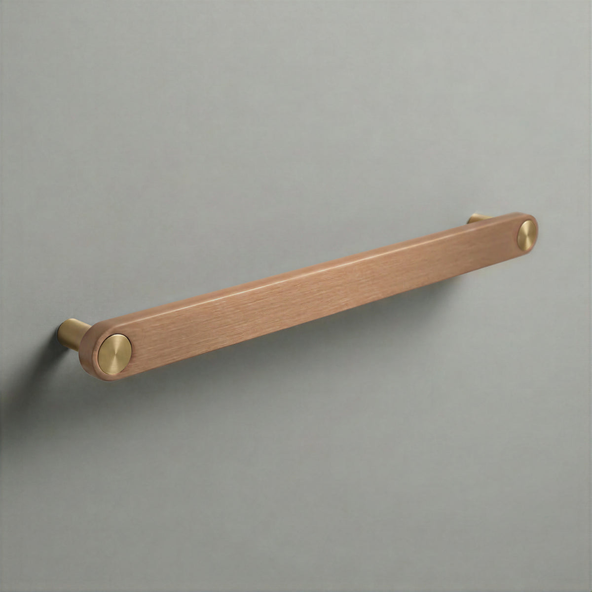 Brushed Copper Ensemble Handle in 224mm (8⅞″) Centres size with Brass button detail by Sloan Roberts.