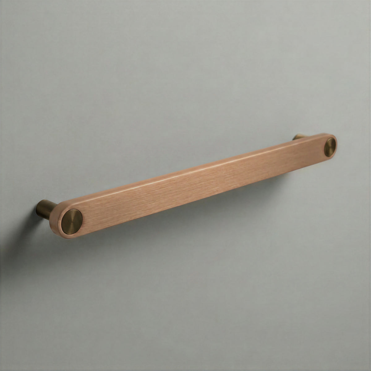 Brushed Copper Ensemble Handle in 224mm (8⅞″) Centres size with Aged Bronze button detail by Sloan Roberts.