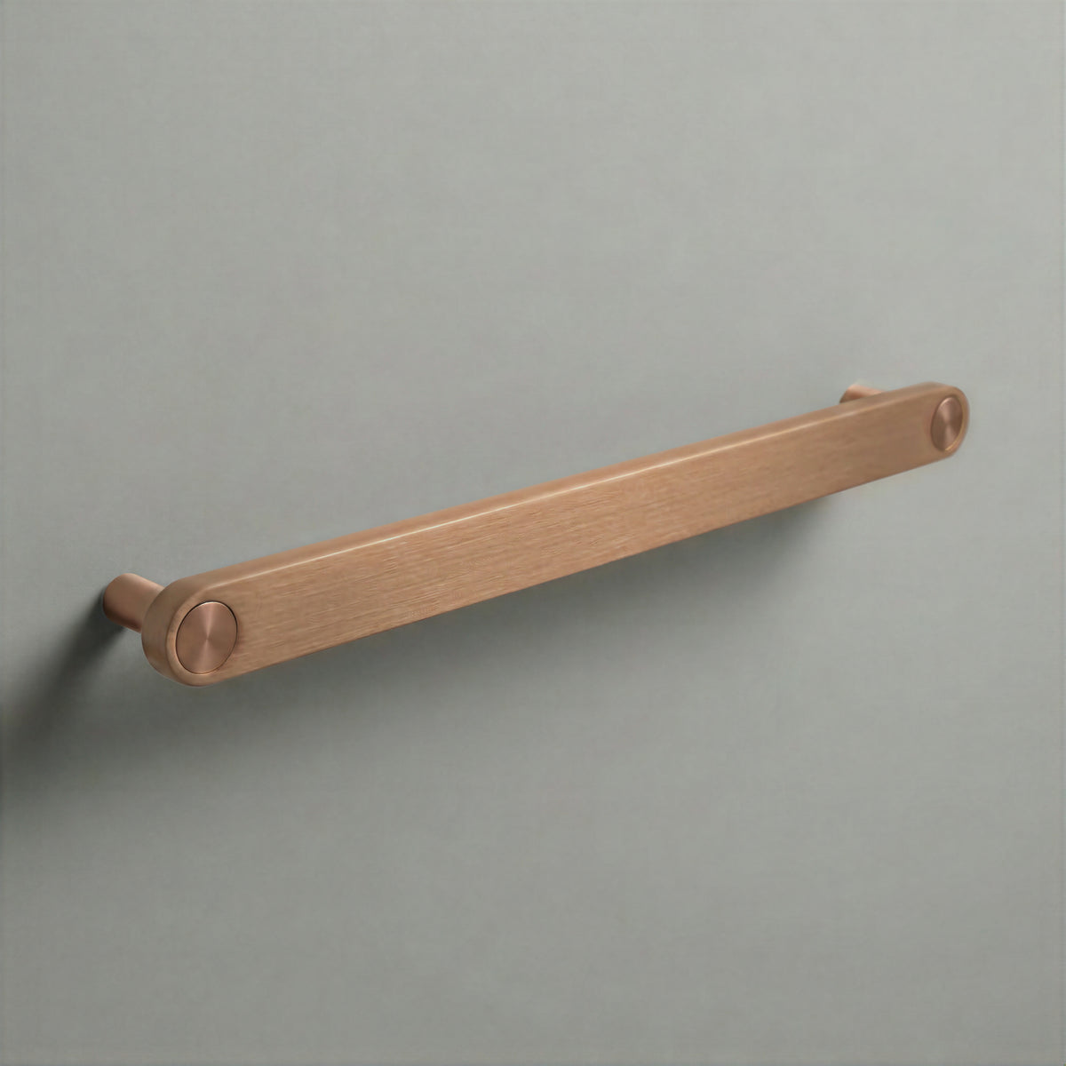 Brushed Copper Ensemble Handle in 224mm (8⅞″) Centres size with Brushed Copper button detail by Sloan Roberts.