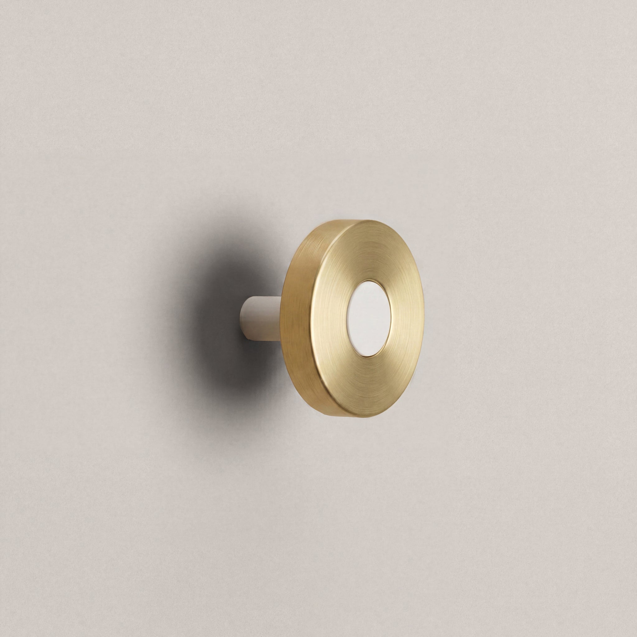 Brass Ensemble Handle in Knob size with Matte White button detail by Sloan Roberts.