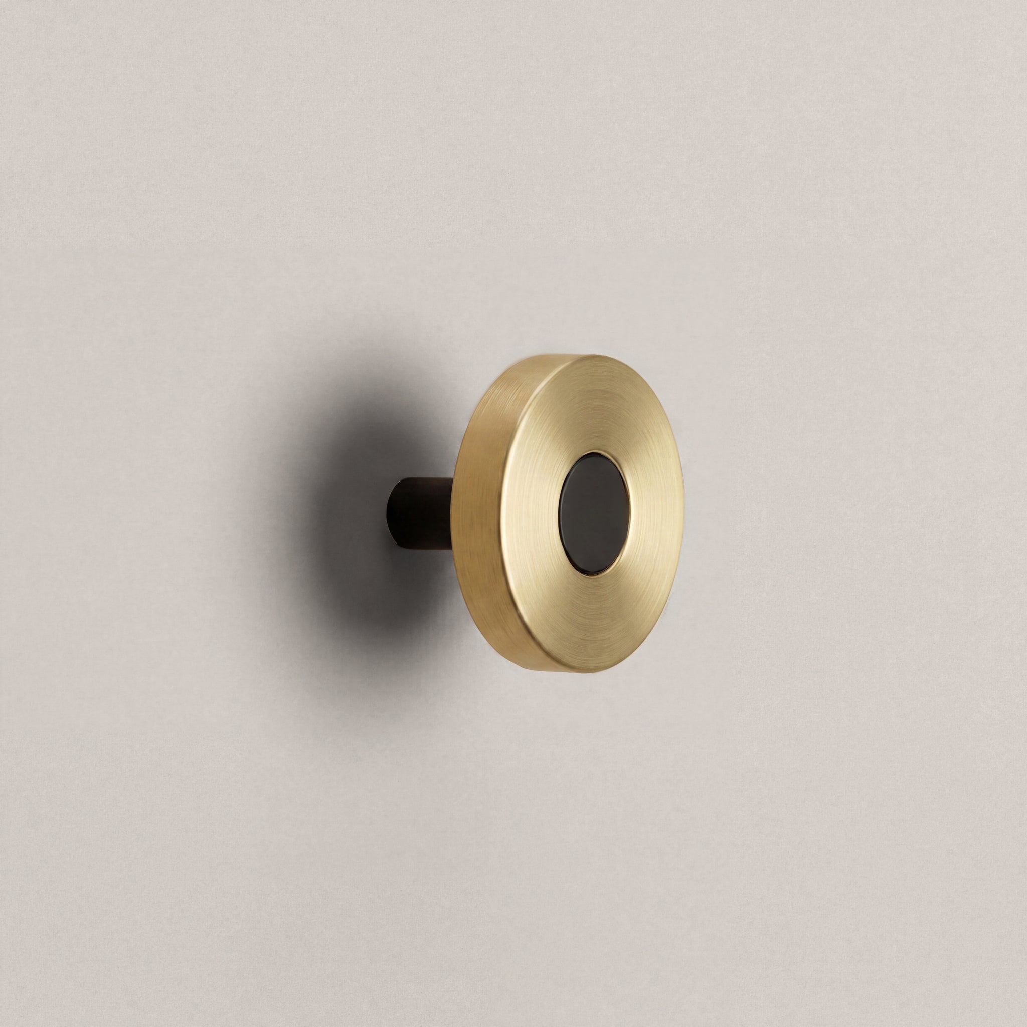 Brass Ensemble Handle in Knob size with Matte Black button detail by Sloan Roberts.