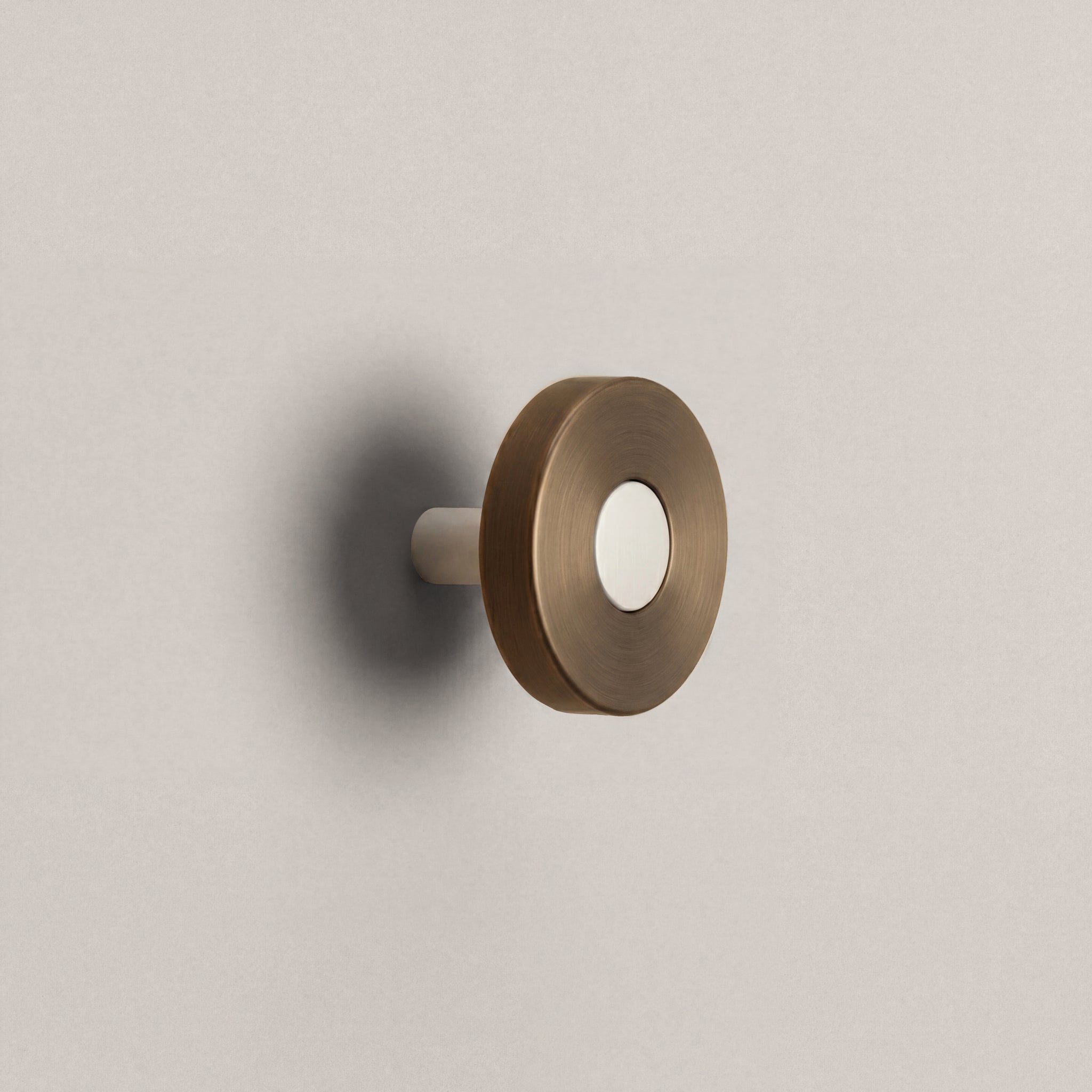 Aged Bronze Ensemble Handle in Knob size with Matte White button detail by Sloan Roberts.
