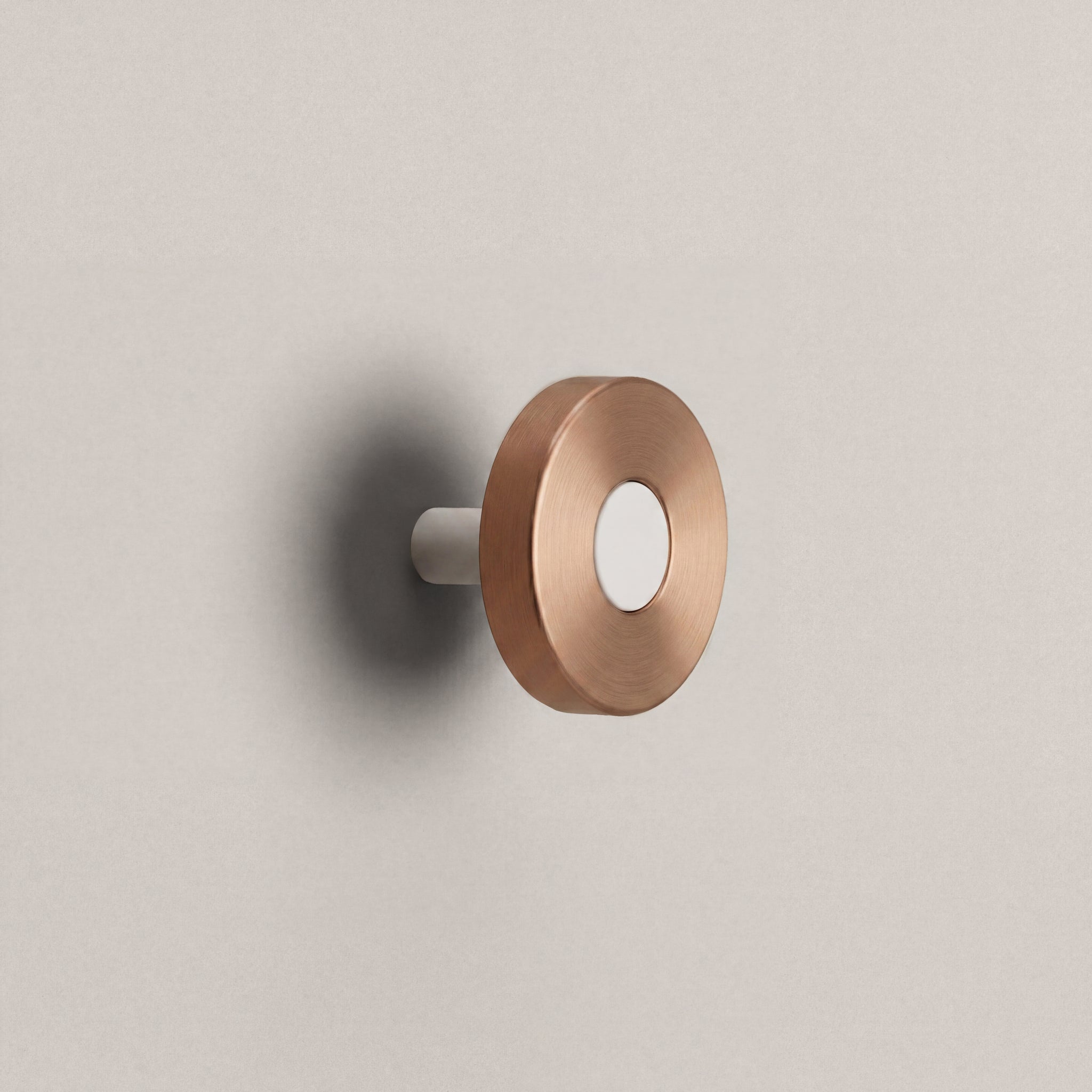 Brushed Copper Ensemble Handle in Knob size with Matte White button detail by Sloan Roberts.