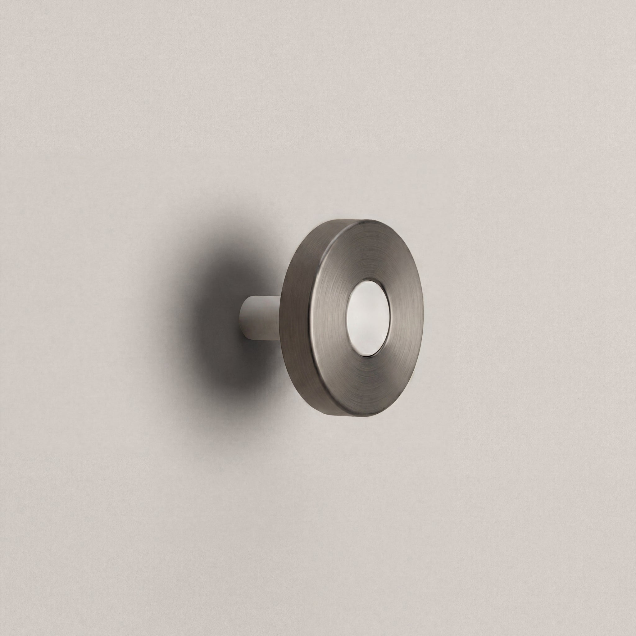 Gunmetal Ensemble Handle in Knob size with Matte White button detail by Sloan Roberts.