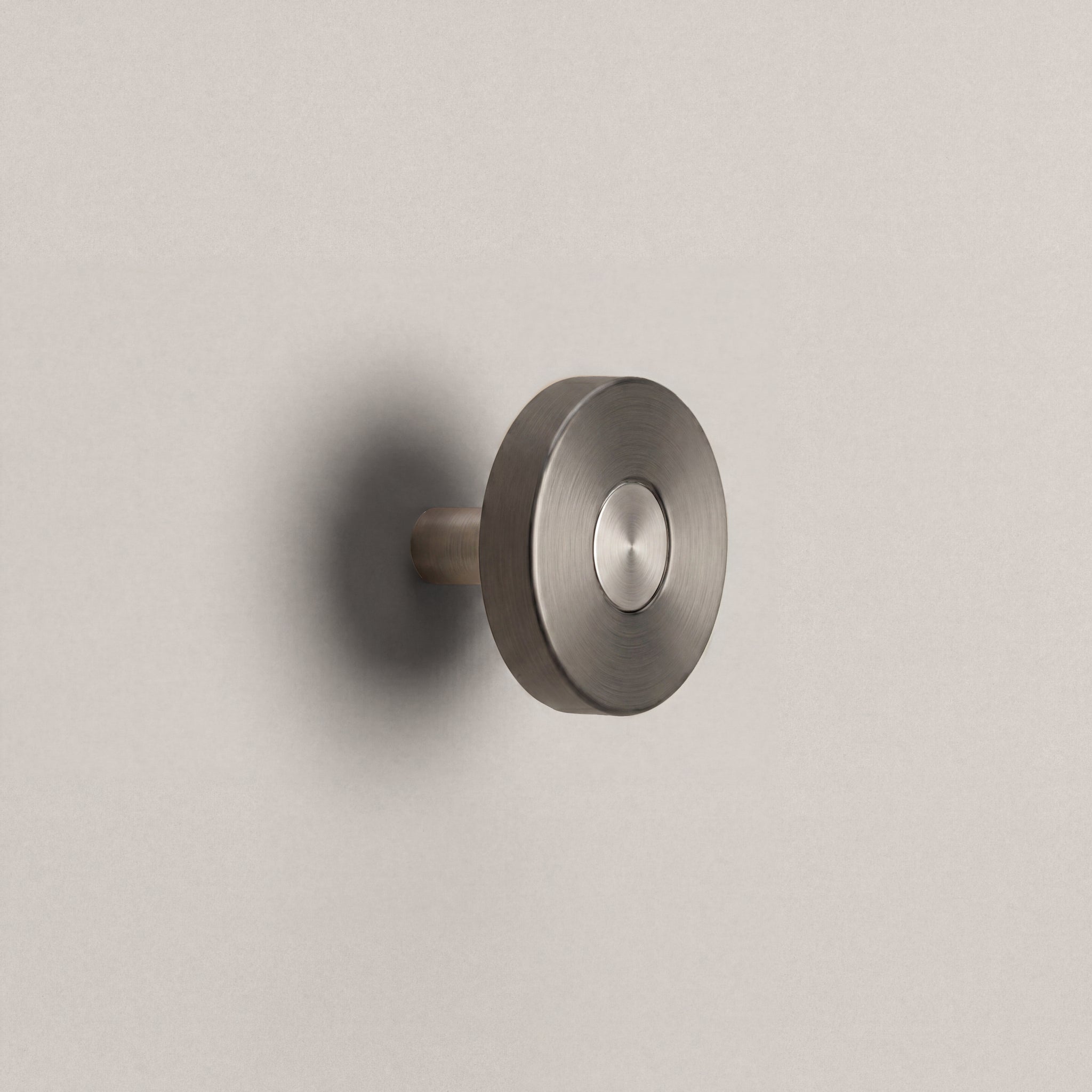 Gunmetal Ensemble Handle in Knob size with Brushed Steel button detail by Sloan Roberts.