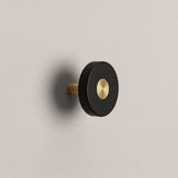 Matte Black Ensemble Handle in Knob size with Brass button detail by Sloan Roberts.