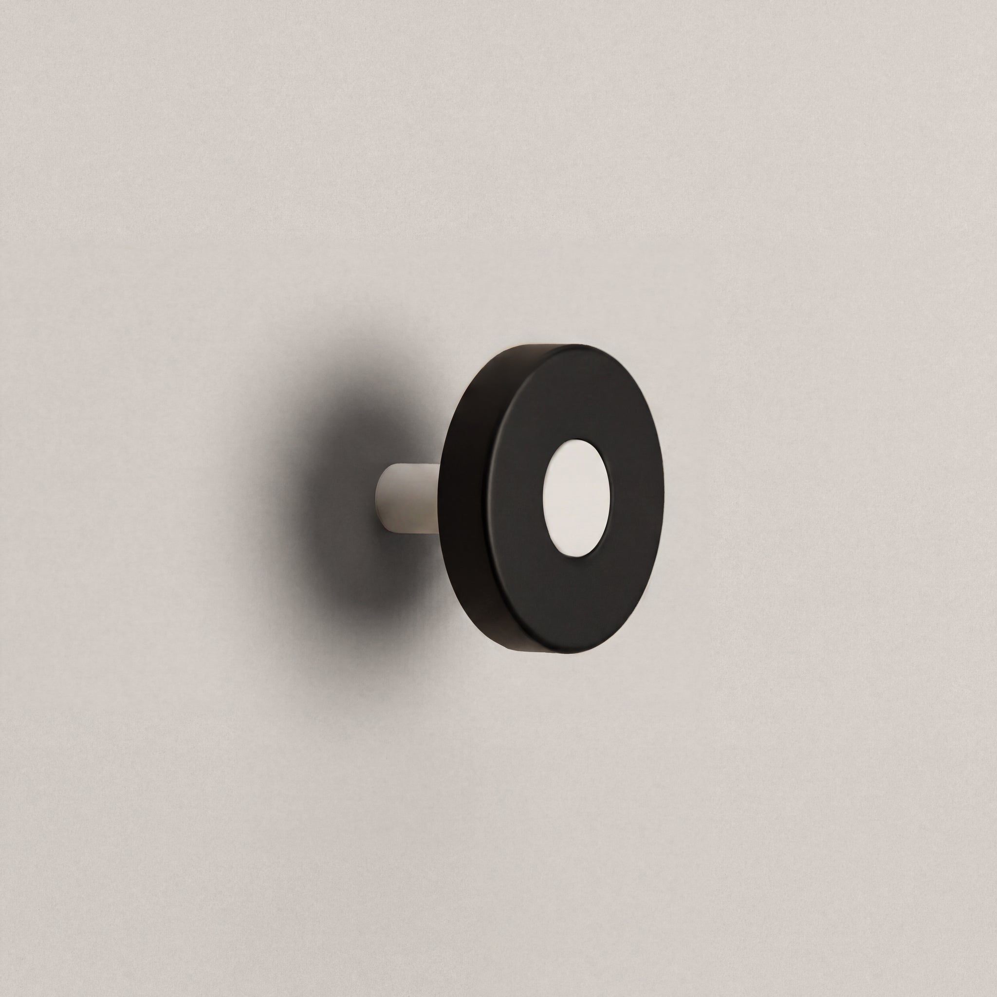 Matte Black Ensemble Handle in Knob size with Matte White button detail by Sloan Roberts.