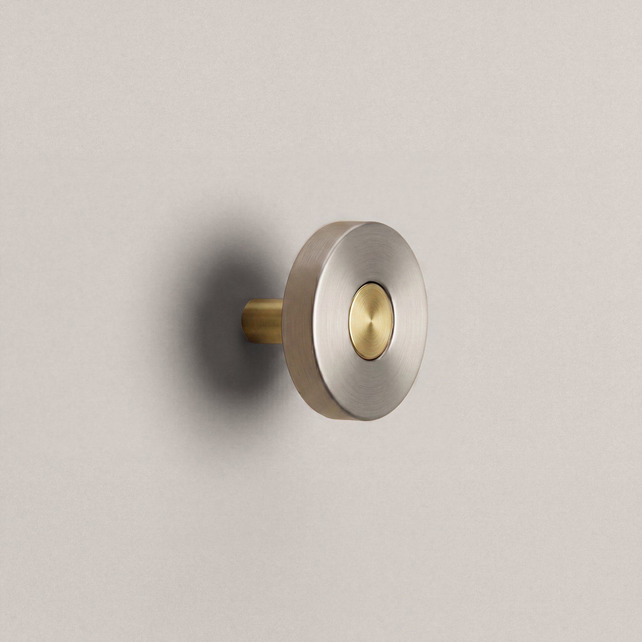 Brushed Steel Ensemble Handle in Knob size with Brass button detail by Sloan Roberts.