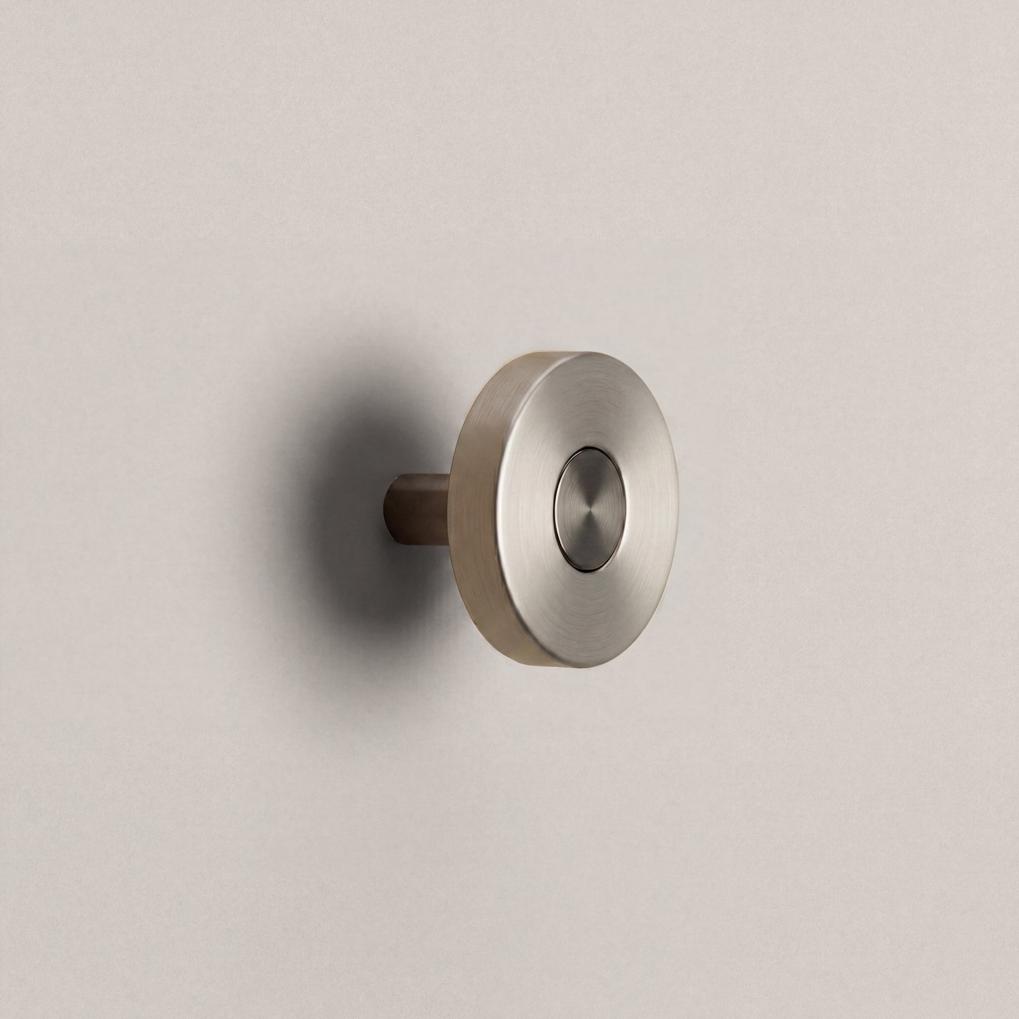Brushed Steel Ensemble Handle in Knob size with Gunmetal button detail by Sloan Roberts.
