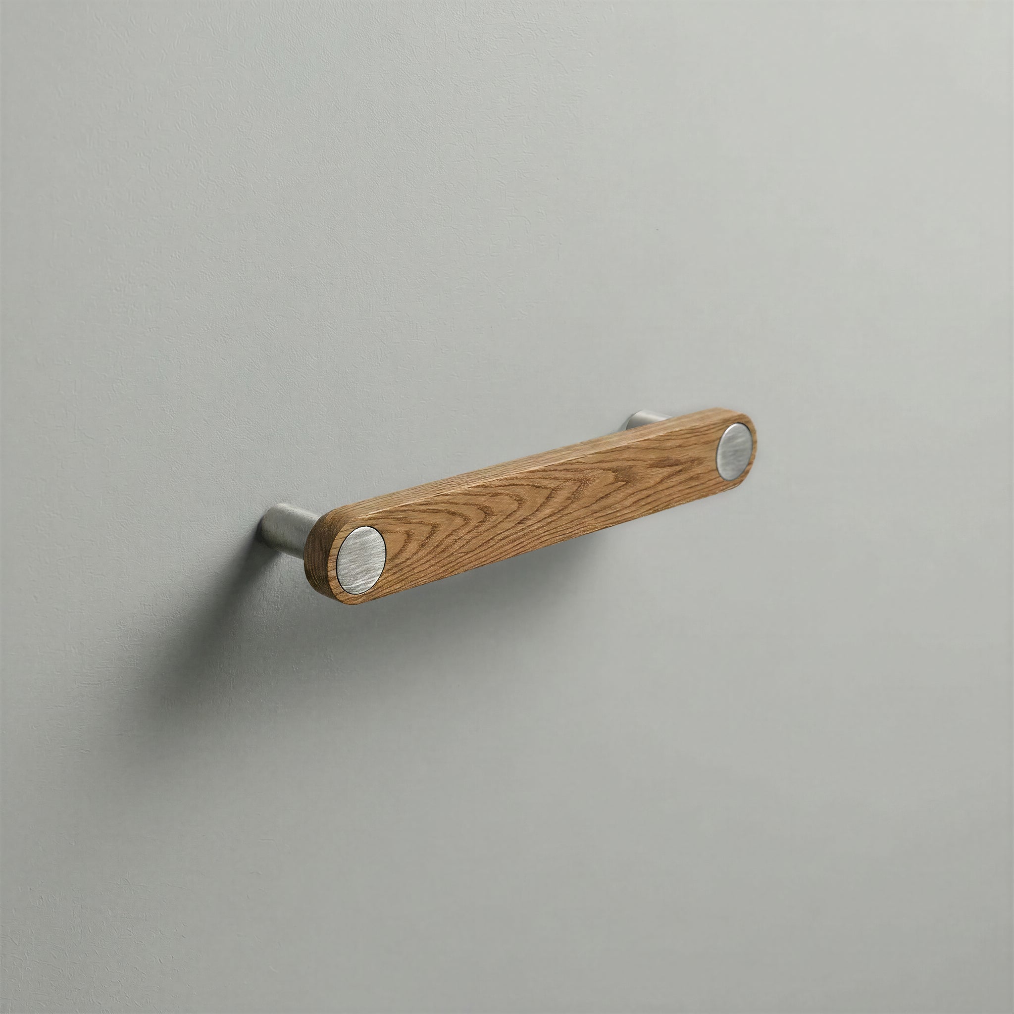Oak Ensemble Handle in 128mm Centres with Brushed Steel button detail by Sloan Roberts.