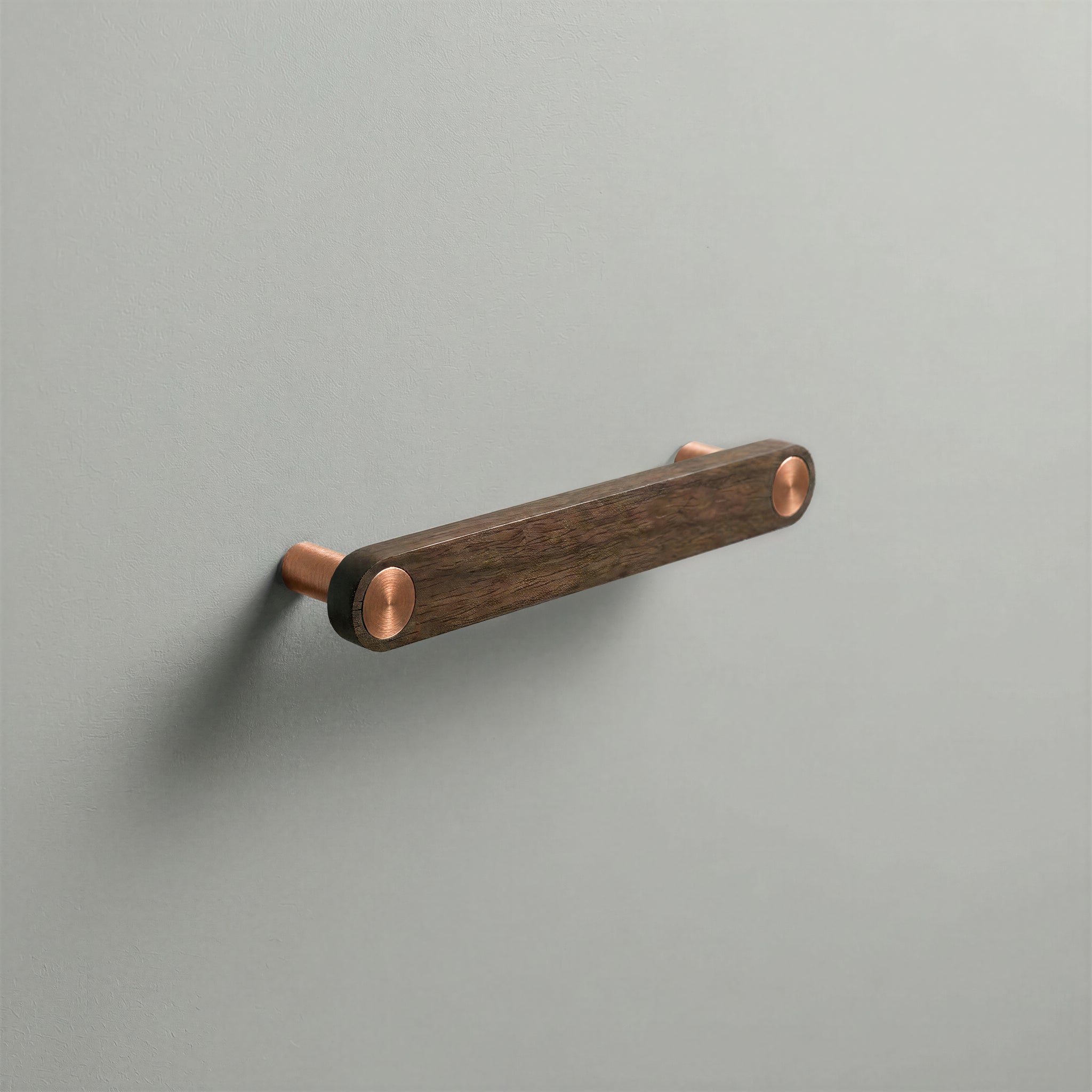 Walnut Ensemble Handle in 128mm Centres with Brushed Copper button detail by Sloan Roberts.