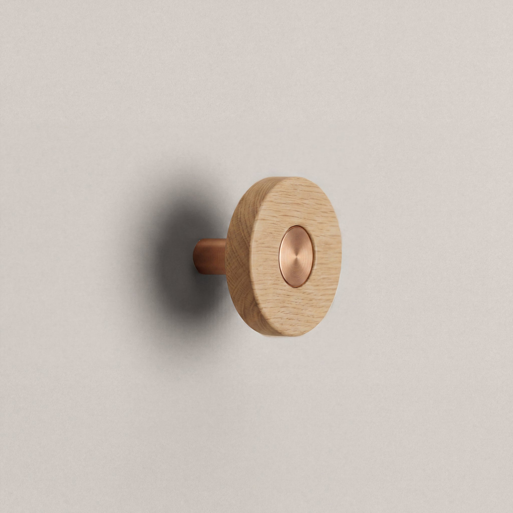 Oak Ensemble Handle in Knob size with Brushed Copper button detail by Sloan Roberts.