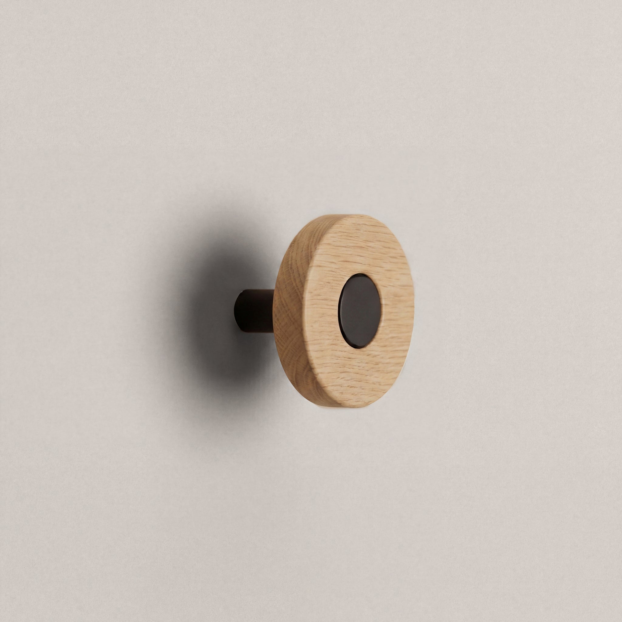 Oak Ensemble Handle in Knob size with Matte Black button detail by Sloan Roberts.