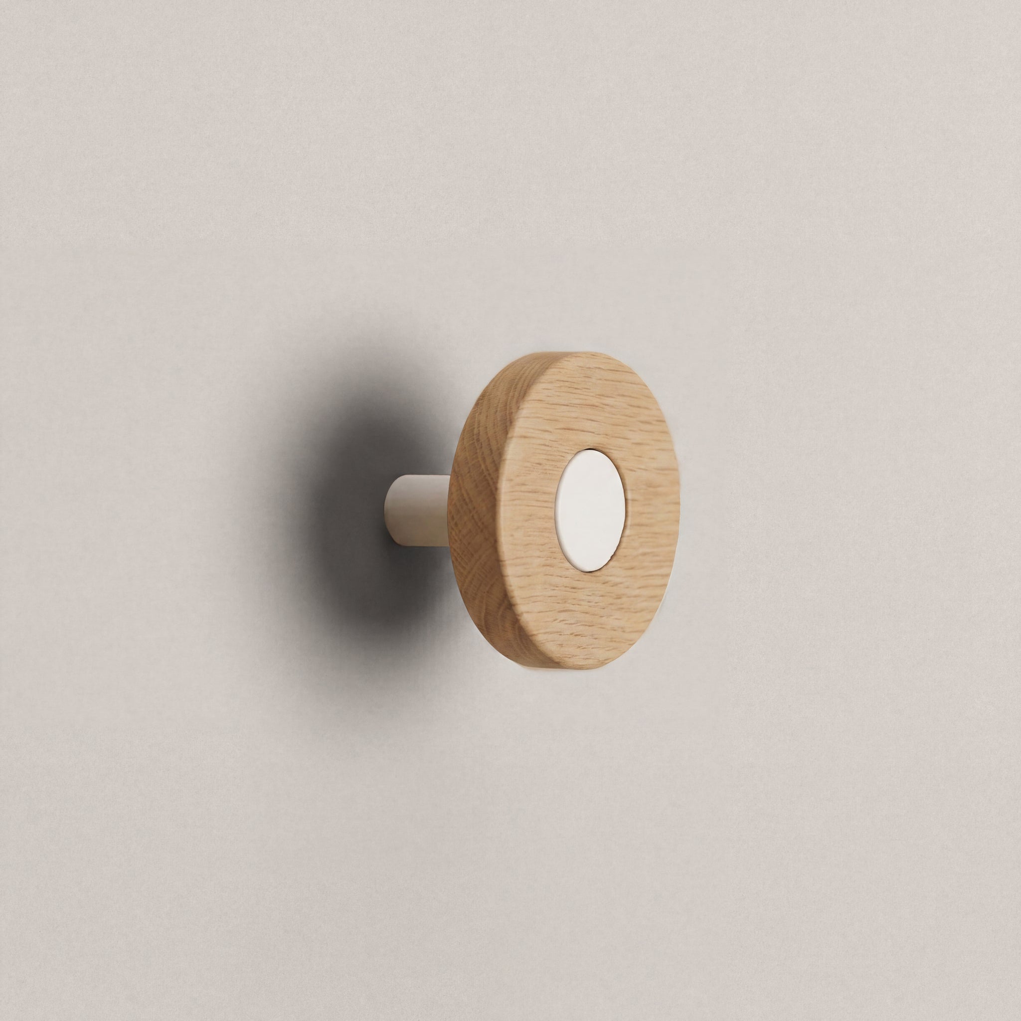 Oak Ensemble Handle in Knob size with Matte White button detail by Sloan Roberts.